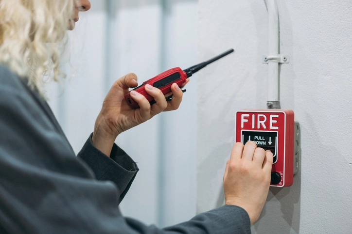 Warehouse workers use talkie of an emergency in a factory worker